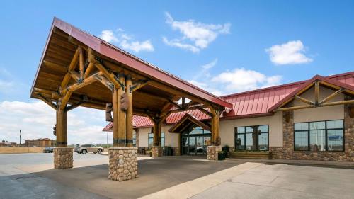 a large building with a red roof at Best Western Ramkota Hotel in Rapid City