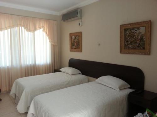 A bed or beds in a room at Hotel La Casona