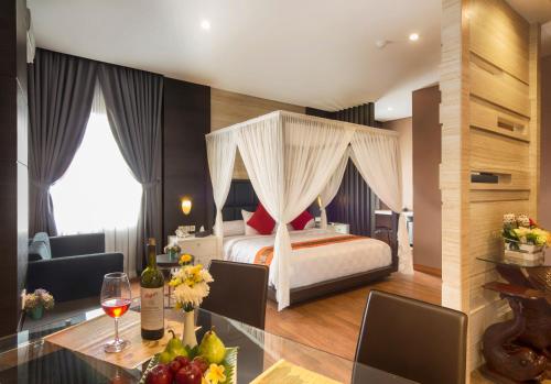 a hotel room with a bed and a table with fruits at Hotel 88 Kopo Bandung By WH in Bandung