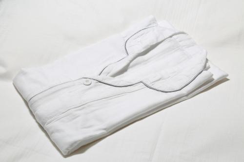 a white shirt laying on a white background at Daiwa Roynet Hotel Koriyama Ekimae in Koriyama