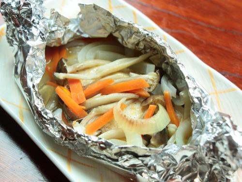 a plate of food with carrots and onions in foil at Chouchinya in Nozawa Onsen