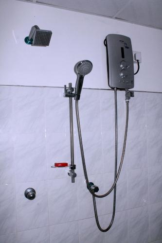 a shower in a bathroom with a shower head at Elliot Nature Resort in Galle