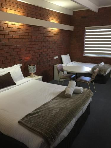 Ένα ή περισσότερα κρεβάτια σε δωμάτιο στο Wattle Motel