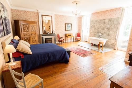 a bedroom with a bed and a living room at Préchac Park in Préchac