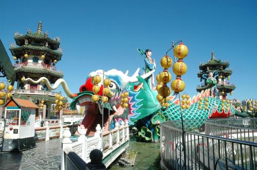 a ride at a carnival with a dragon statue at MILORD BOUTIQUE HOTEL in Kaohsiung