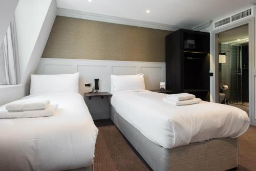 Katil atau katil-katil dalam bilik di Mowbray Court Hotel