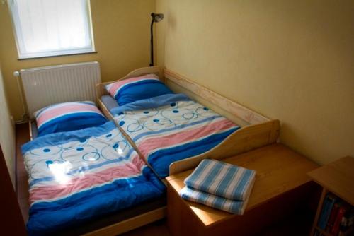 a bed with two pillows on it in a bedroom at Ferienhaus Doris in Dwasieden