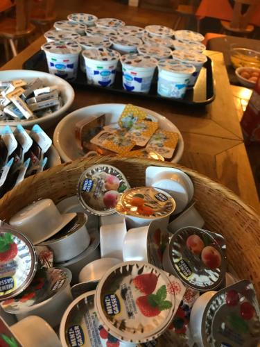 a table topped with plates and bowls of food at Albergo Slalom in Belluno