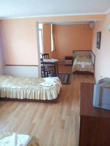 Ένα ή περισσότερα κρεβάτια σε δωμάτιο στο Hotel Triumph