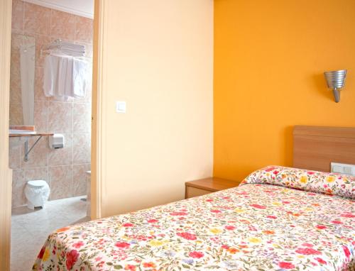 Ένα ή περισσότερα κρεβάτια σε δωμάτιο στο Pension Europa