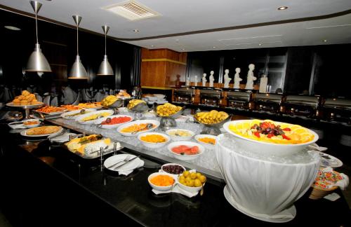 a buffet line with many different types of food at Coastlands Umhlanga Hotel and Convention Centre in Durban