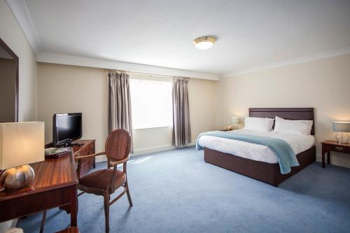 Ένα ή περισσότερα κρεβάτια σε δωμάτιο στο The Walnut Tree Hotel
