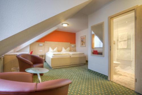 Hotel Stolberg tesisinde bir odada yatak veya yataklar