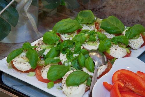 a plate of food with eggs and vegetables on it at Hotel Stolberg in Wiesbaden
