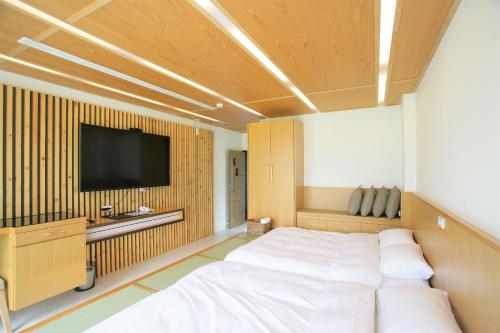 מיטה או מיטות בחדר ב-Xianel Vacation Chateau