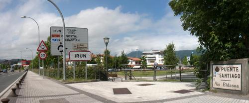 a street with signs on the side of a road at Hotel Aitana in Irún