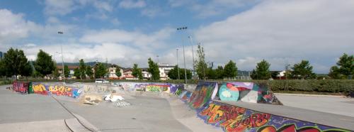 a skate park with a skateboard ramp with graffiti at Hotel Aitana in Irún