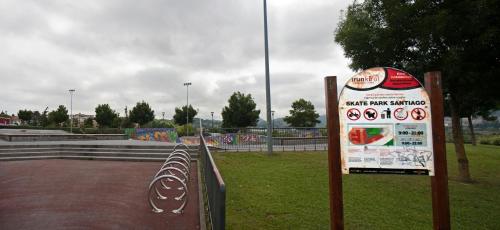 a sign in front of a skate park with graffiti at Hotel Aitana in Irún