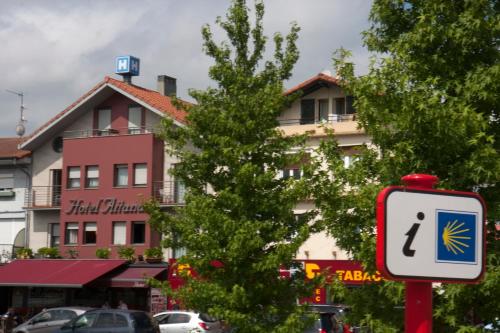 a street sign in front of a building at Hotel Aitana in Irún