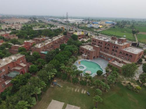 an aerial view of a resort with a swimming pool at Magsons Resorts in Vrindāvan