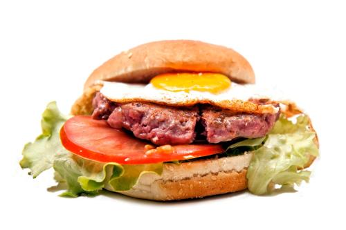 a sandwich with meat and an egg and lettuce at Hotel Aitana in Irún