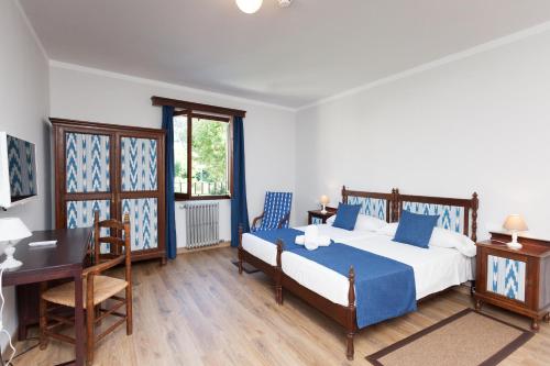 Katil atau katil-katil dalam bilik di Hotel El Guía