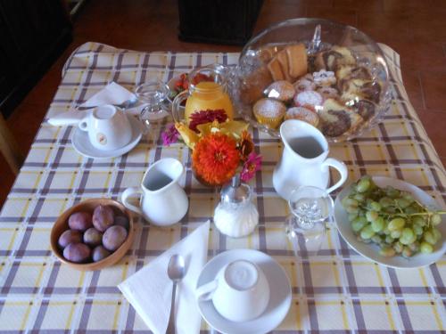 a table with a platter of food on a table at La Tavernetta in Masainas