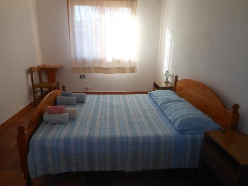 Een bed of bedden in een kamer bij La Tavernetta