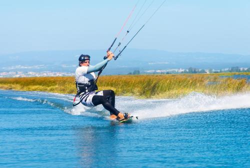 a man water skiing on a body of water at Casa da Magnólia in Murtosa