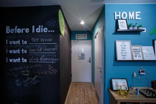 a room with a chalkboard on the wall at Safestay Warsaw Old Town in Warsaw