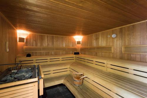 a sauna with wood paneling at Htel Serviced Apartments Amstelveen in Amstelveen