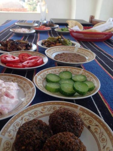 a table full of plates of food on a table at Cleopatra Hotel Luxor in Luxor