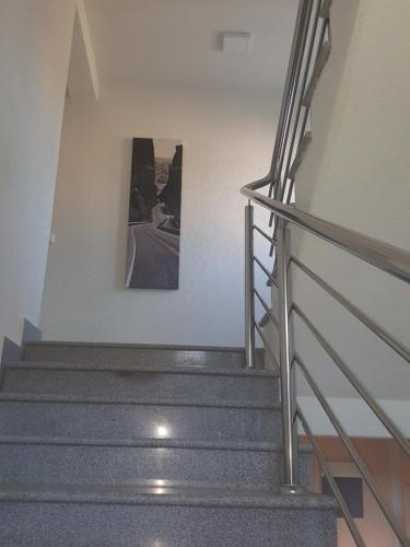 a staircase in a building with a picture on the wall at Apartment Vila Mirela in Krimovice