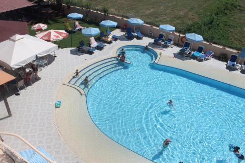 an overhead view of a swimming pool at a hotel at Ninos On The Beach Hotel in Roda