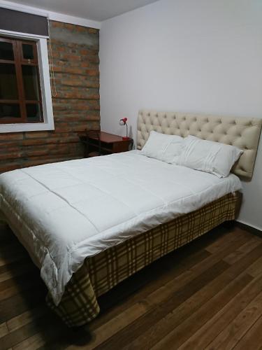 Apartamentos Colonial Homeにあるベッド
