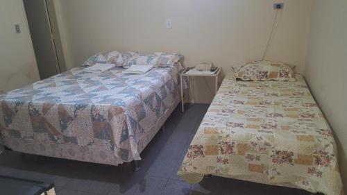 A bed or beds in a room at Pousada Portal do Cariri