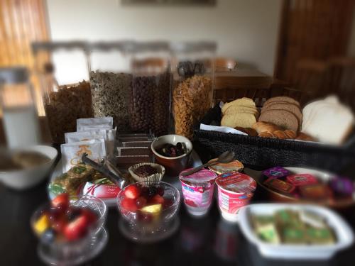 a table topped with lots of different types of food at Fir Tree Barn in Pollington