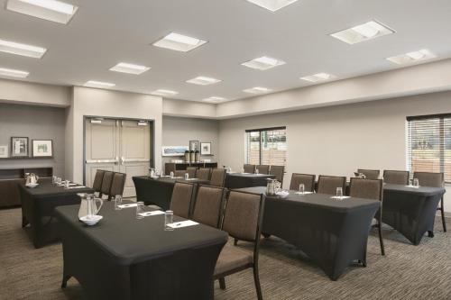 a conference room with tables and chairs in it at Country Inn & Suites by Radisson, Charlottesville-UVA, VA in Charlottesville