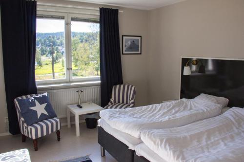 Postel nebo postele na pokoji v ubytování Docksta Hotell
