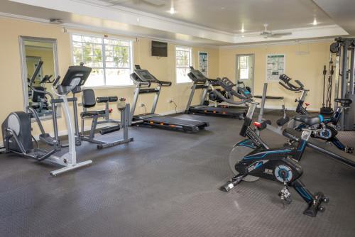 a gym with a bunch of exercise bikes in a room at Bay Gardens Beach Resort & Spa in Gros Islet