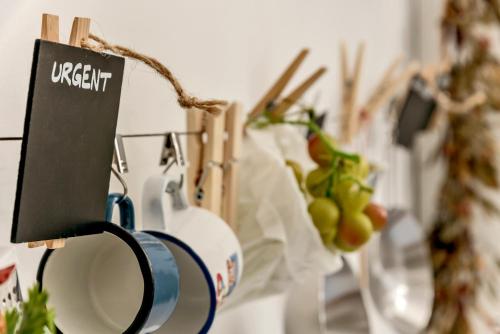 a sign that reads urgent next to some plants at Beachfront Apartment Mala Tereza in Split