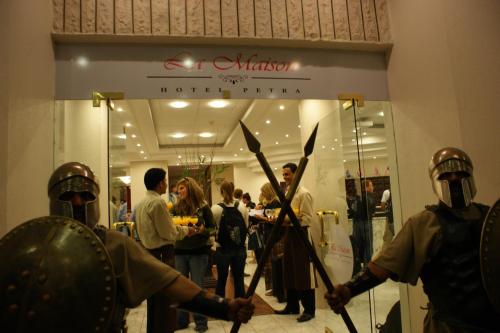 a group of people wearing armour in front of a store at La Maison Hotel in Wadi Musa
