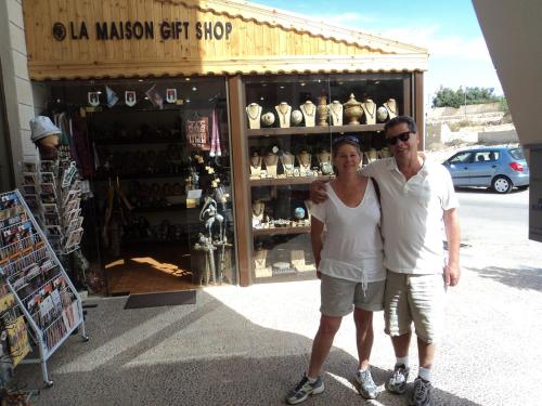 a man and a woman standing in front of a store at La Maison Hotel in Wadi Musa