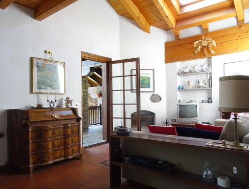 a living room with a couch and a table at La Rouine - Morgex in Morgex