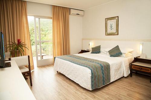 Giường trong phòng chung tại Plaza Caldas da Imperatriz Resort & Spa