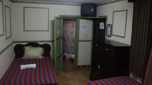 Cama o camas de una habitación en Hotel Calle Ancha