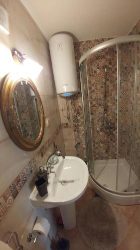 a bathroom with a sink and a shower at Bella Vista Zmukic in Perast