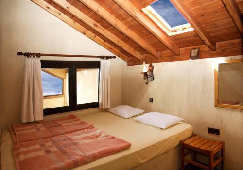 Postel nebo postele na pokoji v ubytování DIMITRA's VILLAS