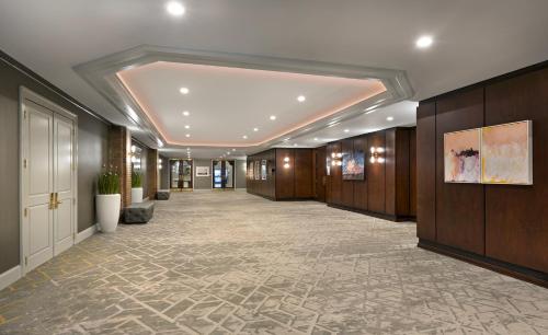 a large hallway with a lobby with a hallwayngth at The DeSoto in Savannah