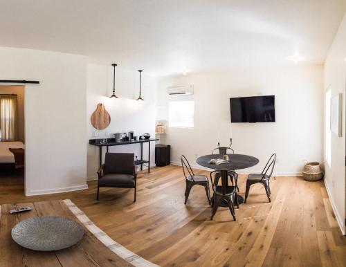 a dining room and living room with a table and chairs at Contigo Ranch Fredericksburg in Fredericksburg